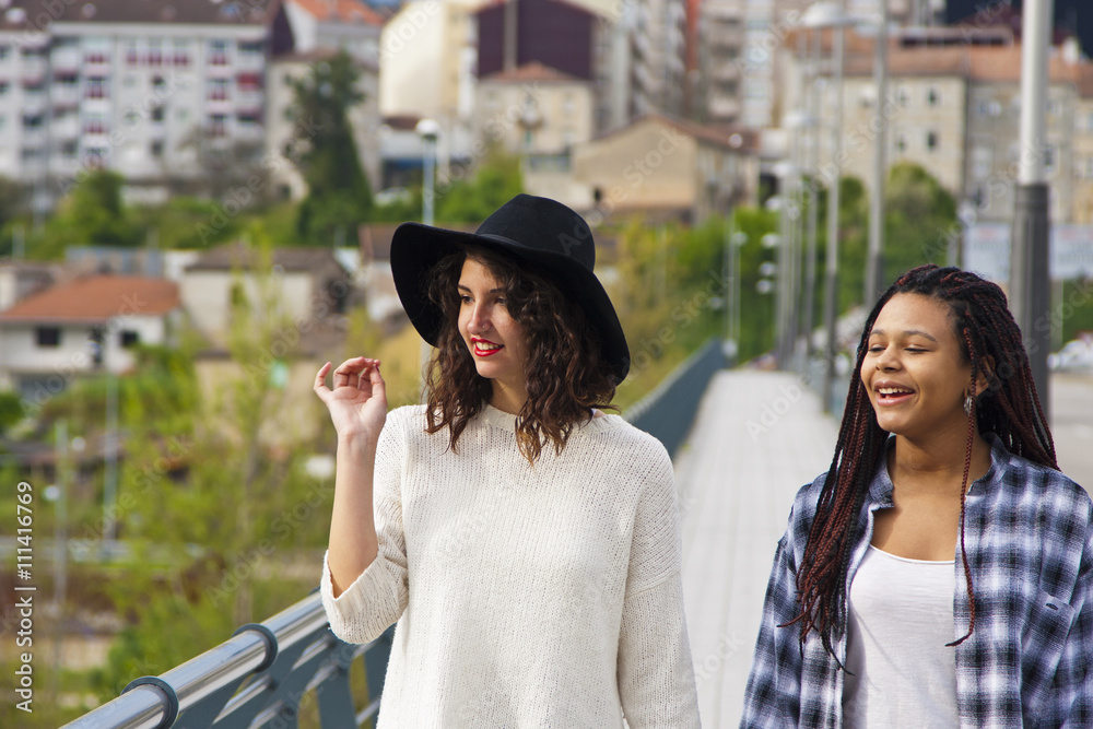 Fototapeta premium girls walking down the street