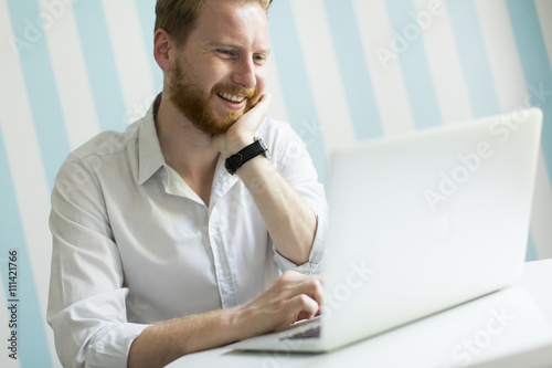 Man with a laptop at home
