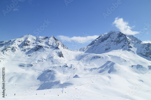 Alpine resort of Les Arcs with ski slopes on snowy French Alps mountains © Yols