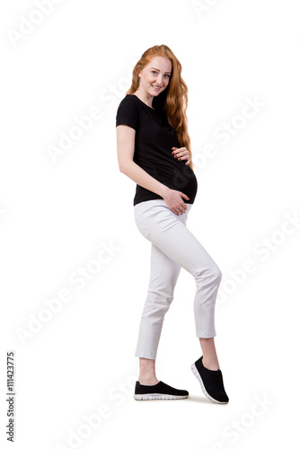 Young pregnant woman isolated on white