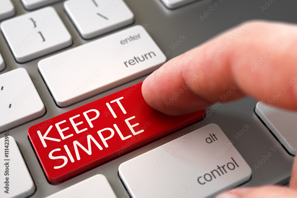 Finger Pressing a Modern Laptop Keyboard Key with Keep It Simple Sign.  Finger Pushing Keep It