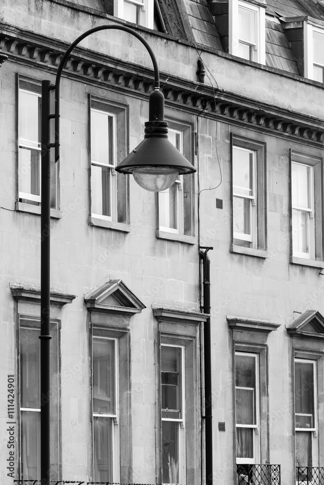Lamp post and Georgian windows in background, Bath, England vertical black and white photography