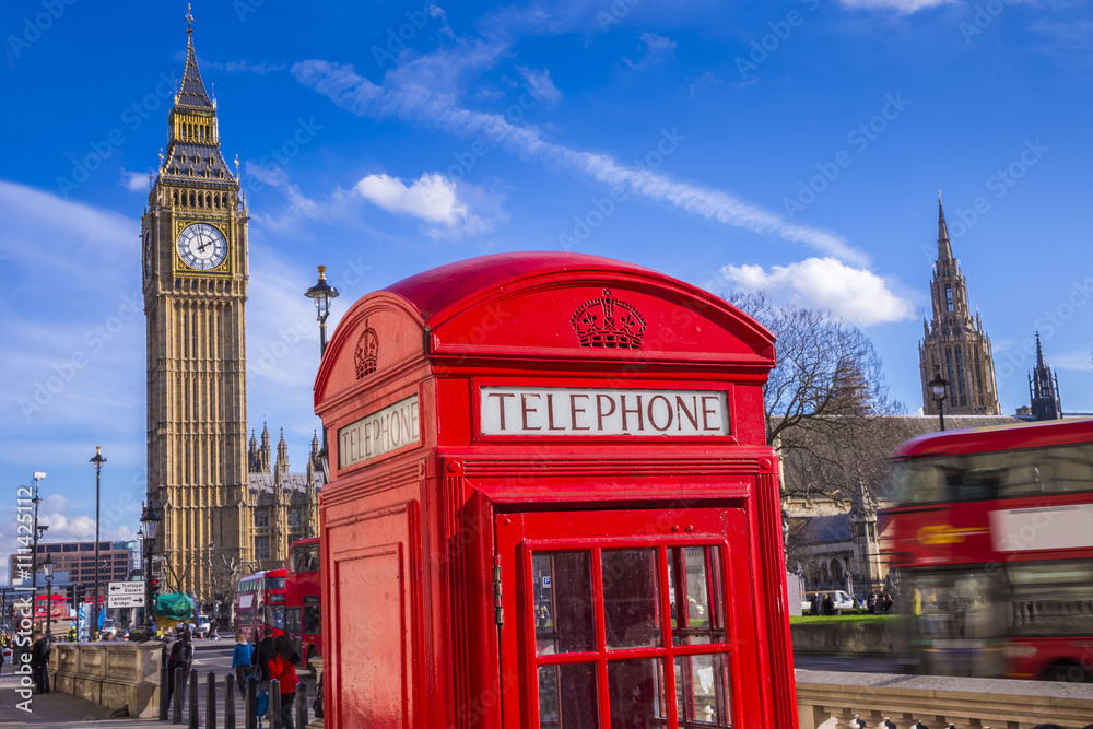 Obraz premium London, England - Classic Red Telephone Box and Big Ben and Houses of Parliament with Double Decker bus and blue sky