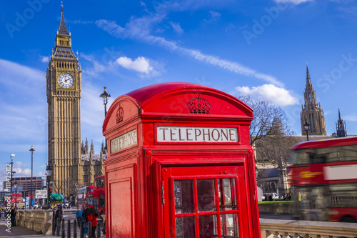 London  England - Classic Red Telephone Box and Big Ben and Houses of Parliament with Double Decker bus and blue sky