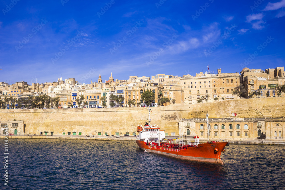 Malta - The ancient city of Valletta with ship and clear blue sky