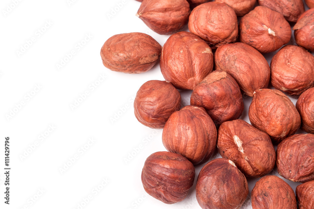 peeled hazelnuts isolated on white background macro