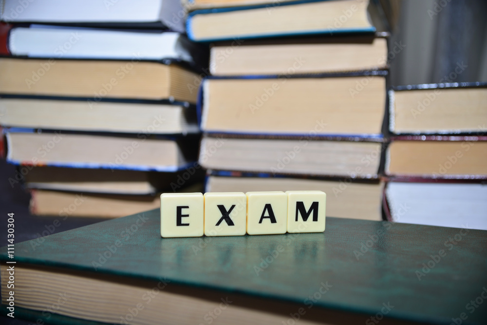 word exam near the pile of books word exam near the pile of books