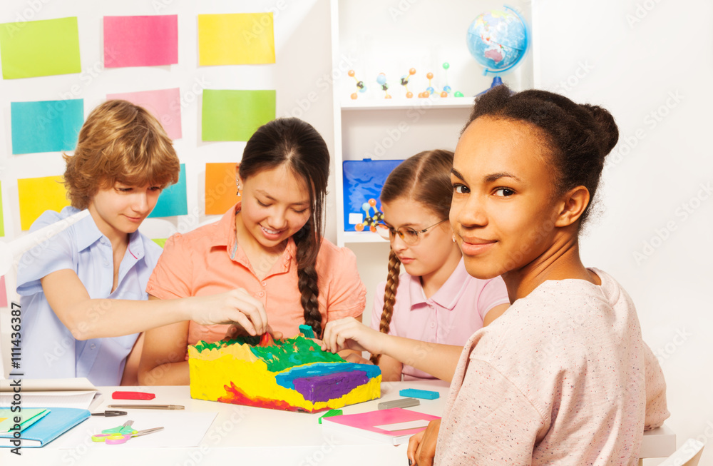 Students learning geography at the classroom