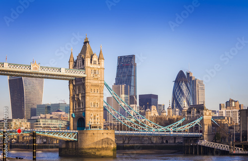 London  England - Iconic Tower Bridge in the morning sunlight with Bank District at background  