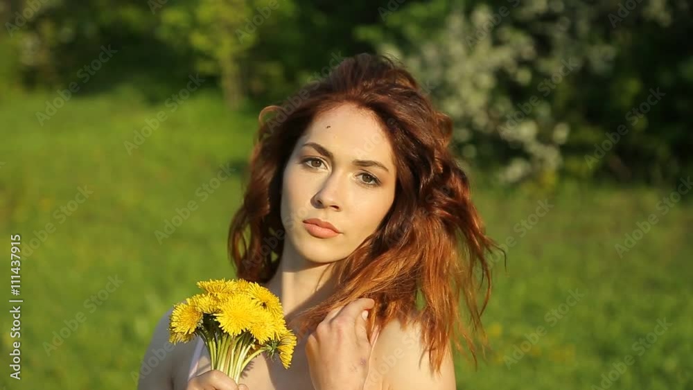 Young woman looking at camera smiling Young woman looking at camera smiling