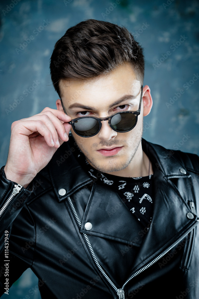Portrait of Casual handsome attractive man hipster guy wearing leather jacket