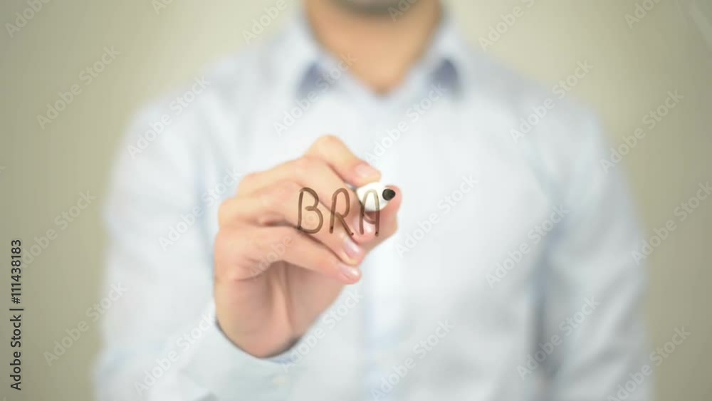 Brand, Man writing on transparent screen Brand, Man writing on transparent screen