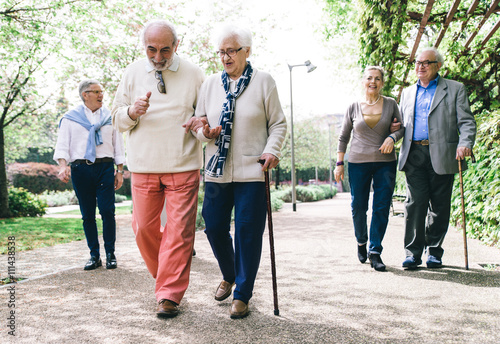 Group of old people walking outdoor