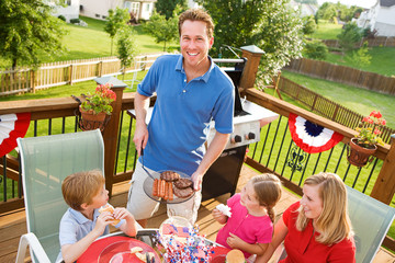 Summer: Dad Serves Up Hamburgers and Hot Dogs