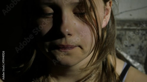Depressed teenager is sad and guilty. Closeup portrait. 4K UHD.