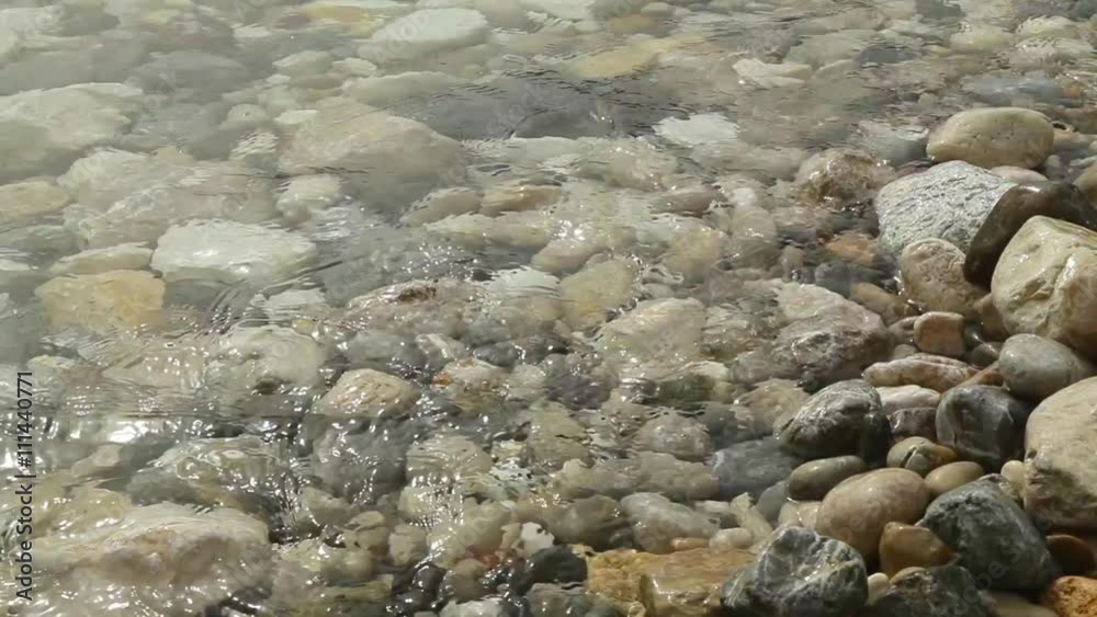 Waves washed pebble beach. Waves washed pebble beach.