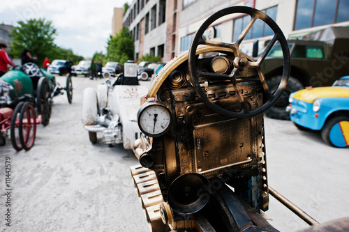 Iron handmade steering wheel at vintage sport car
