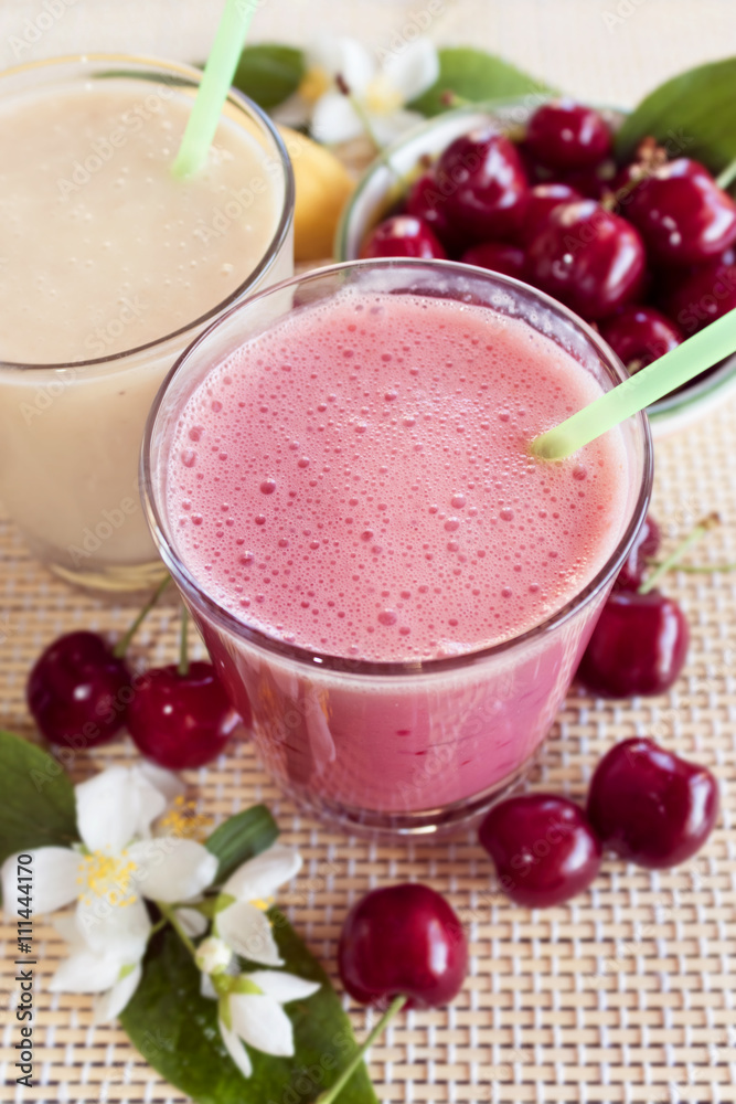 Cherry and banana and milk smoothie. Milkshake with cherries and bananas. Cherry and banana and milk smoothie. Milkshake with cherries and bananas.