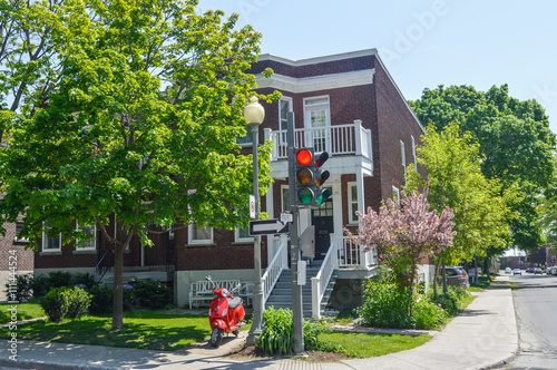 Red traffic light in old Westmount neighborhood.
