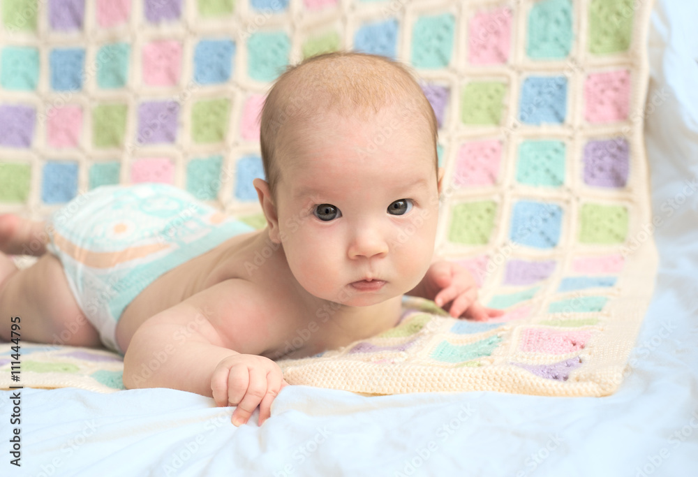 Happy baby lying on his stomach Happy baby lying on his stomach