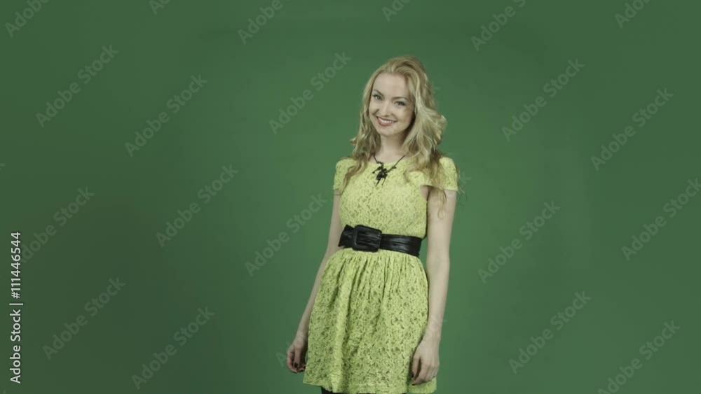 caucasian woman in yellow dress isolated on chroma green screen background confident smiling caucasian woman in yellow dress isolated on chroma green screen background confident smiling