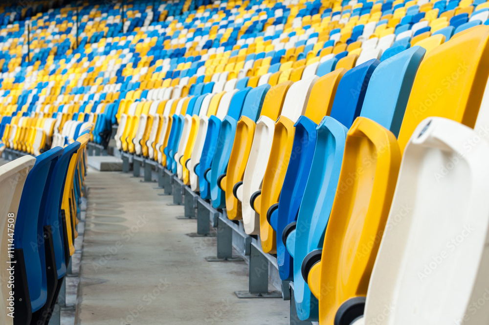 Naklejka premium Empty plastic seats in a footbal or soccer stadium. 2016 sport background