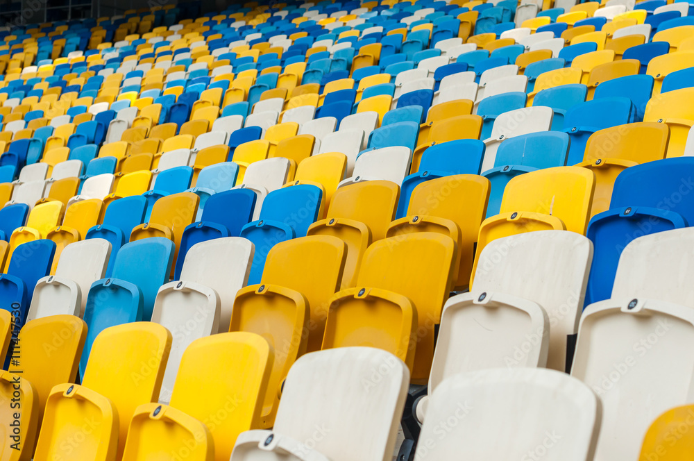 Empty plastic seats in a footbal or soccer stadium. 2016 sport background Empty plastic seats in a footbal or soccer stadium. 2016 sport background