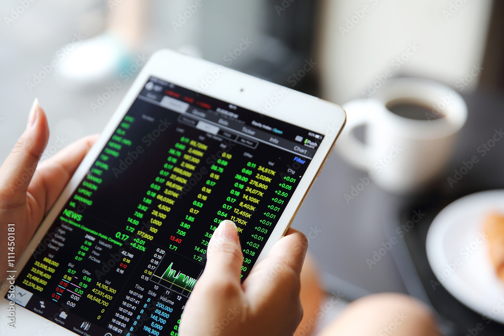 Making trading online on the tablet with business woman hand Making trading online on the tablet with business woman hand