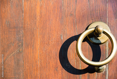 Clappers on a wooden door photo