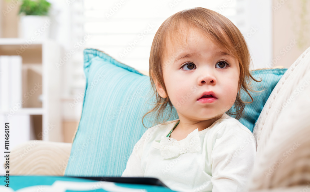 Toddler girl with a tablet computer Toddler girl with a tablet computer
