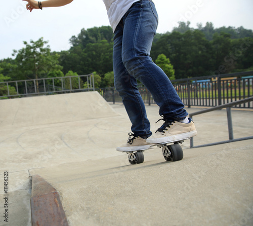 freeline skateboarder legs riding on freeline at skatepark