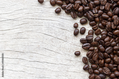 roasted coffee beans on wooden background 