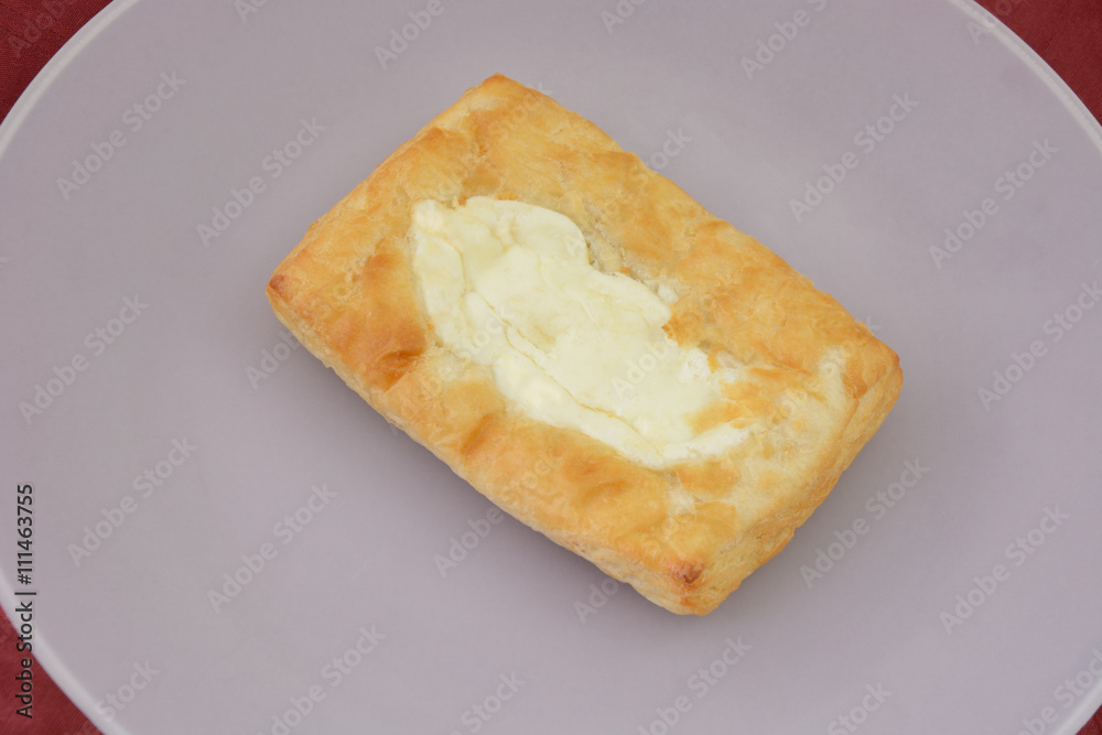 Cheese Danish on white plate