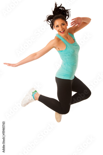 Happy fit and slim woman dancing and jumping isolated over white