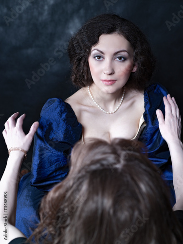 Beautiful girl wearing a medieval dress. XVII