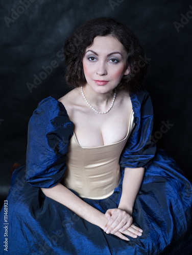 Beautiful girl wearing a medieval dress. XVII