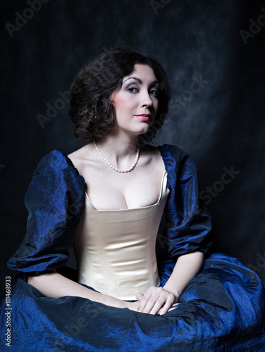 Beautiful girl wearing a medieval dress. XVII