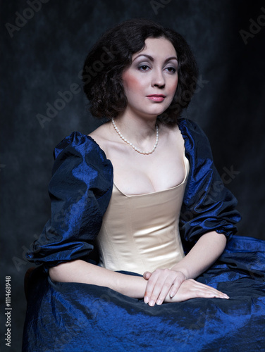 Beautiful girl wearing a medieval dress. XVII