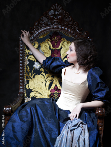 Beautiful girl wearing a medieval dress. XVII