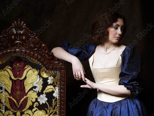 Beautiful girl wearing a medieval dress. XVII