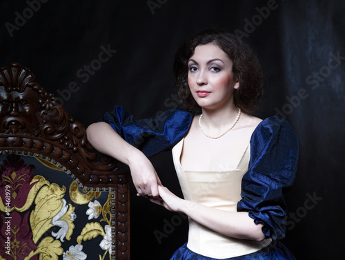 Beautiful girl wearing a medieval dress. XVII