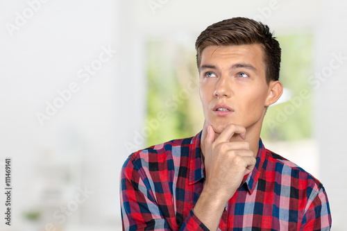 Portrait of handsome young thoughtful man