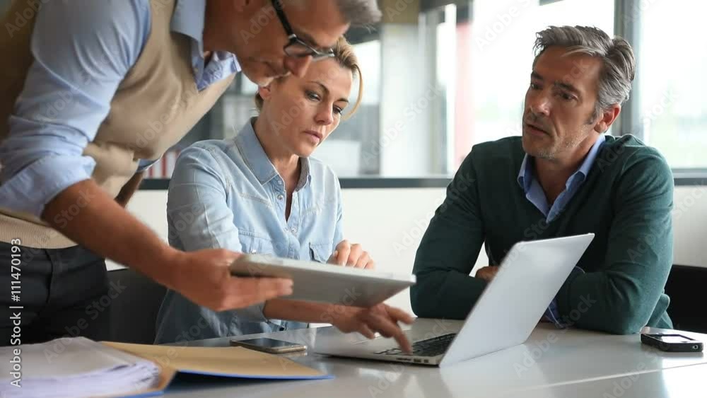 Business people in a meeting using tablet Business people in a meeting using tablet
