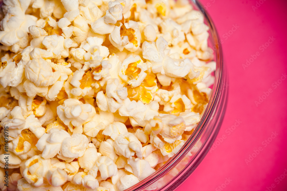 bowl with popcorn on red background bowl with popcorn on red background