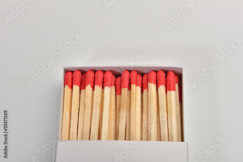 Empty paper matchbox with wooden matches on it. Matchbook case p