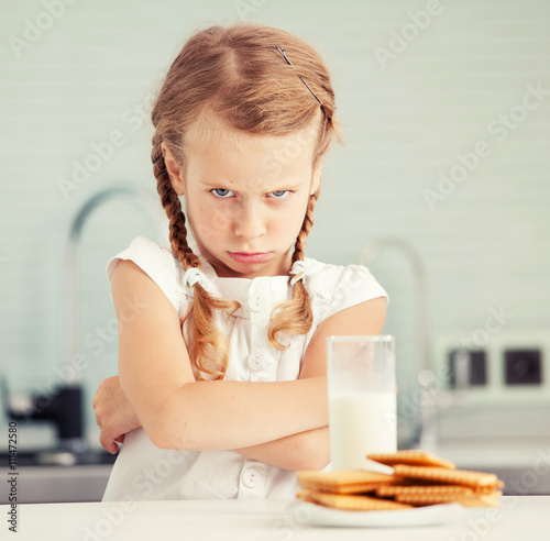 Child looks with disgust for food
