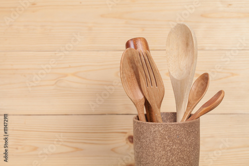 kitchen utensils, wood spoons in coffee mugs on