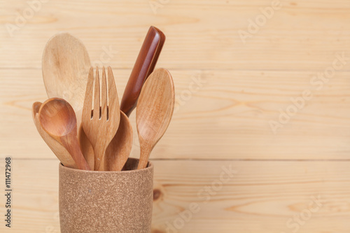 kitchen utensils, wood spoons in coffee mugs on