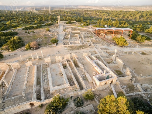 Aerial view of the arcaeological site of Apollon Ilatis sanctuary in Limassol, Cyprus. The ruins of the ancient Greek temple of god Apollonas Ylatis in the old kingdom of Kourion in the woods. photo