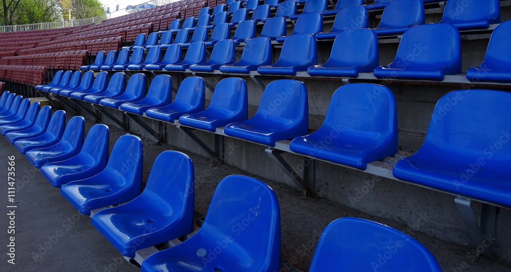 Fototapeta premium Plastic seating section on the grandstand of sport stadium